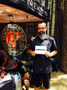 Beall Brewery Insurance held a drawing for an iPad Mini at the 20th Annual Bluesapalooza. Congratulations to Aaron, head brewer at Black Market Brewing Co., who was the winner!